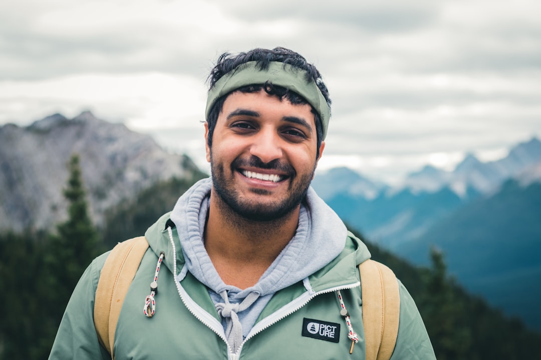 Hiker smiling outdoors in the mountains