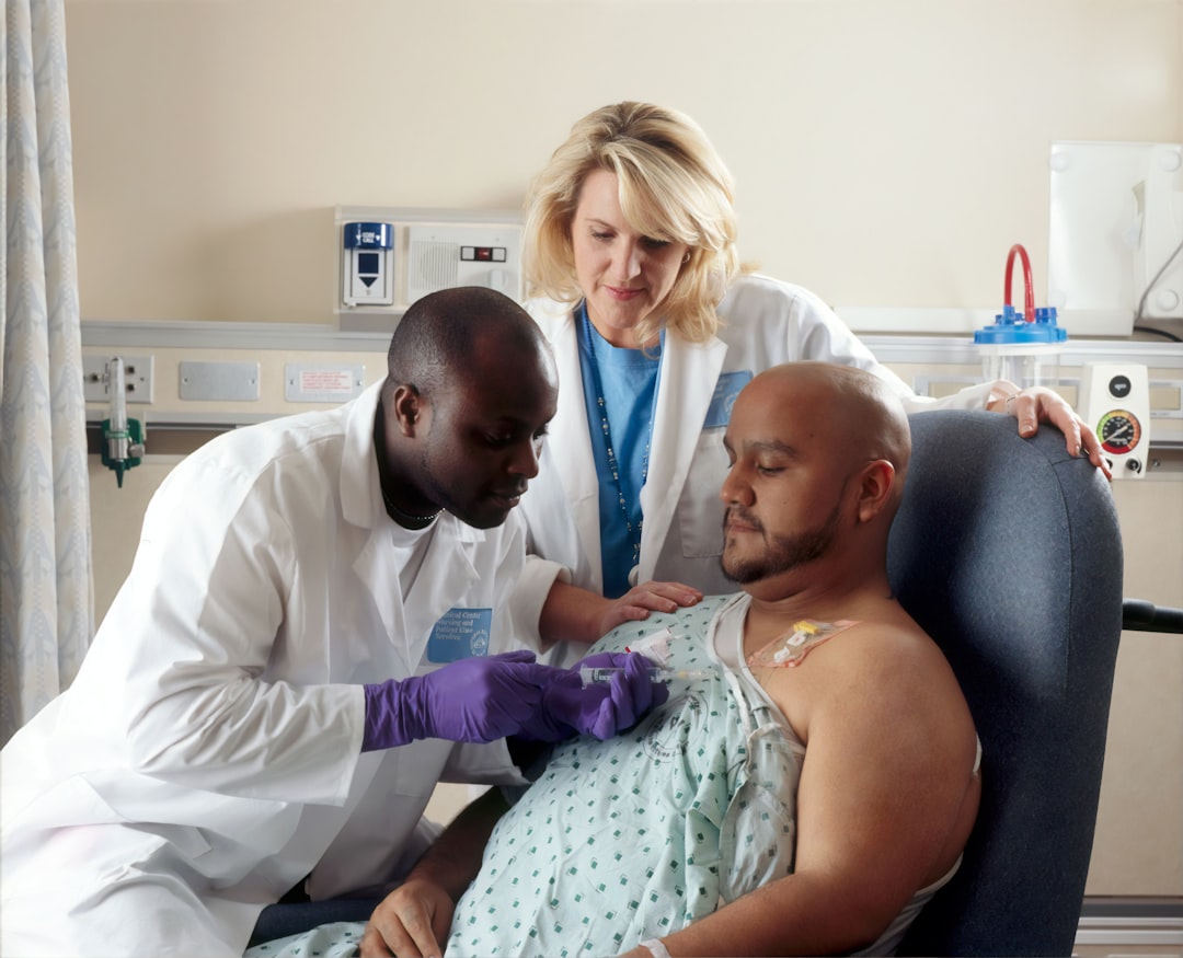 Doctors caring for a patient in a hospital room